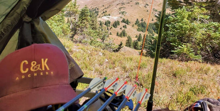 C&K Archery maroon hat and arrows outdoor view Archery Lifestyle Apparel